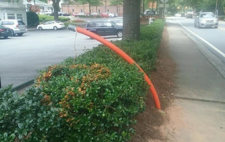 HDPE conduit installed under flower beds and landscaping