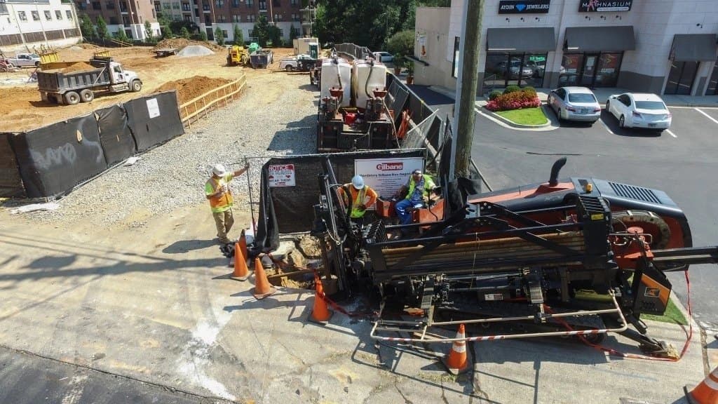 Underground electrical conduit and gas line installation on a city street